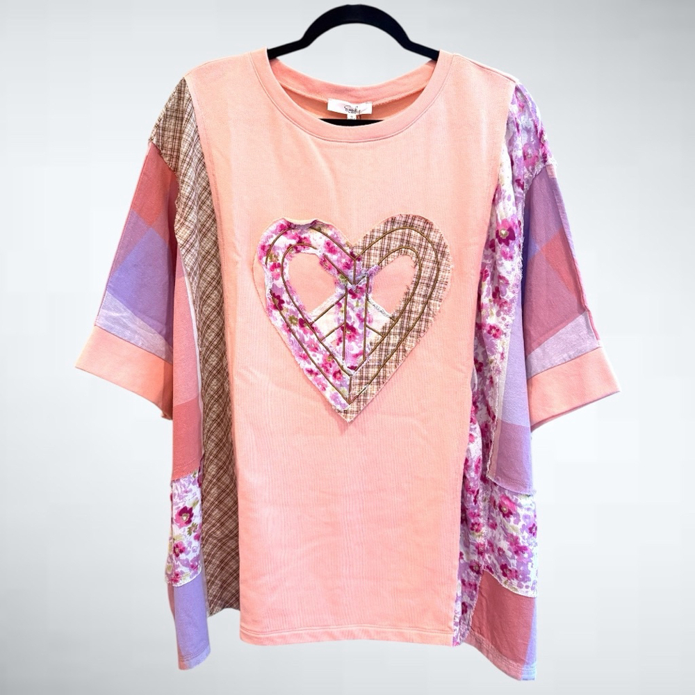 Size S Oversized Easel Heart Patched Top in Peach